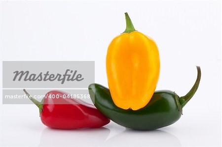 Red and yellow Baby Bell and Jalapeno Peppers on White Background