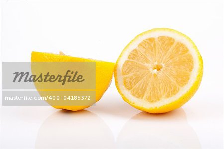 Lemon sliced in half on white background