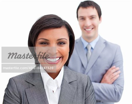 Radiant businesswoman posing in front of her colleague against a white background
