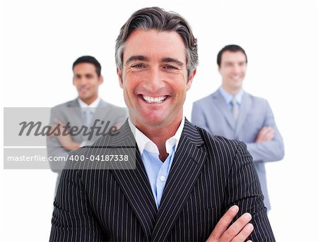 Enthusiastic businessman posing in front of his team against a white background