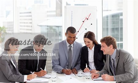 Multi-ethnic business team working together in a meeting
