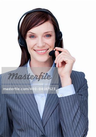Portrait of a smiling businesswoman with headset on against white background