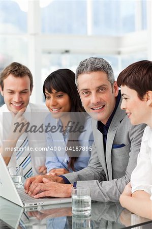 Multi-ethnic business partners sitting together in the office