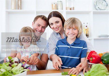 Happy family preparing dinner together in the kitchen