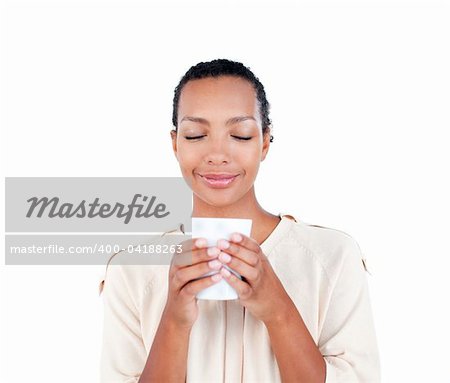Beautiful businesswoman holding a drinking cup against a white background