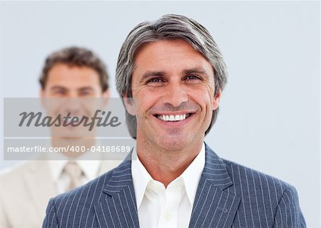 Portrait of two smiling businessmen standing
