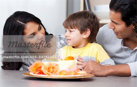 Joyful family celebrating a birthday together at home