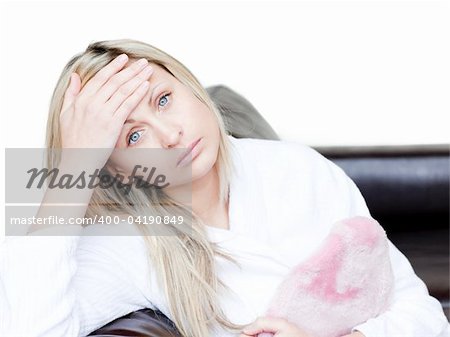 Pensive woman have a headache  against a white background