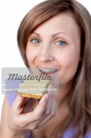 Charming woman eating a cracker with cheese isolated on a white background