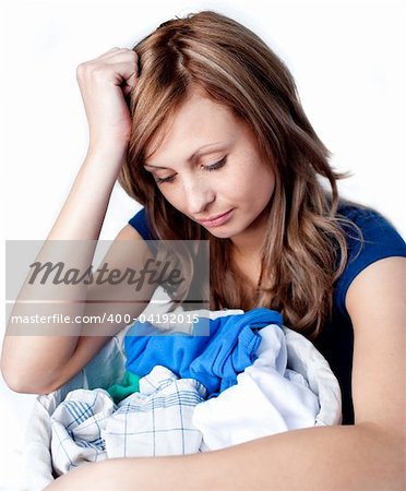Unhappy woman doing laundry isolated on a white background