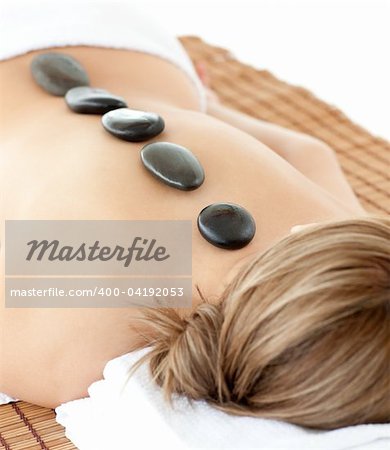 Relaxed woman lying on a massage table at a Spa center