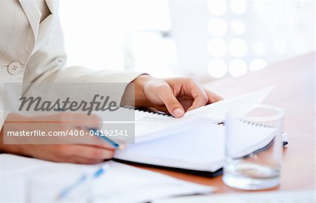 Close-up of a businessman studying a contract in a meeting