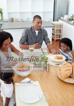 Loving family dining together in the kitchen