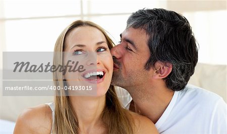 Close-up of a man kissing a beautiful woman