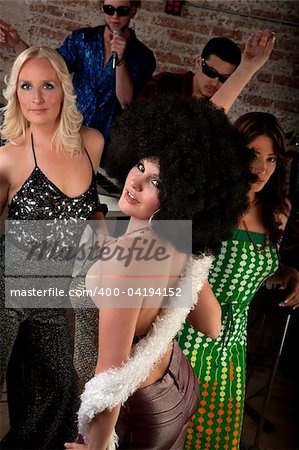Pretty girl with afro wig at a 1970s Disco Music Party