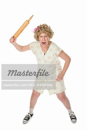 Housewife on white background wielding a rolling pin