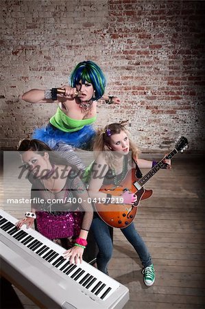 Young all girl punk rock band performing