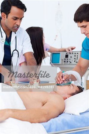 Upset medical team resuscitating a patient at the hospital