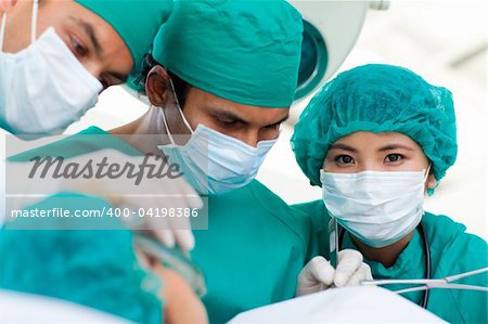 Confident surgeons during a surgery in the hospital