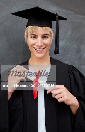 Portrait of teen Guy Celebrating Graduation in the class