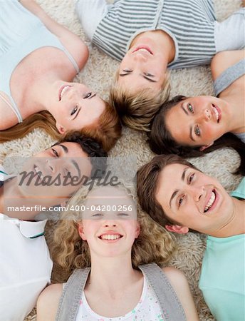 High angle of friends with their heads together smiling