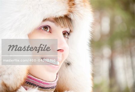 close up winter portrait of young and beautiful natural looking woman in casual clothes