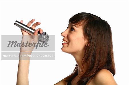 closeup of pretty brunette with silver mic in hand isolated