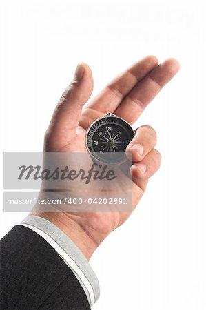 compass in the businessman's hand over white