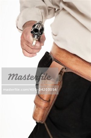 An aimed and cocked pistol pulled out of a leather holster