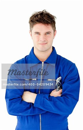 Charismatic mechanic holding tool smiling at the camera against white background