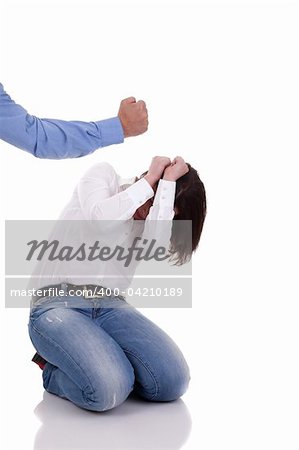 domestic violence: hand of a man, hitting a woman who cringes, isolated on white background. Studio shot.