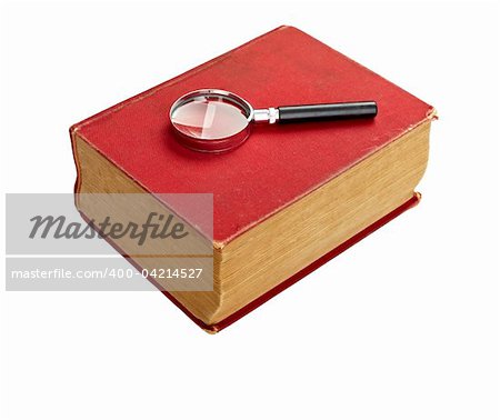 close up of an old book  and loupe on white background with clipping path