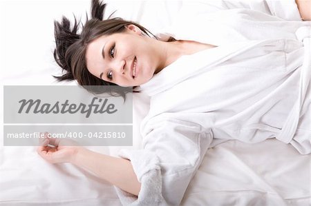 young adult brunette woman in bed