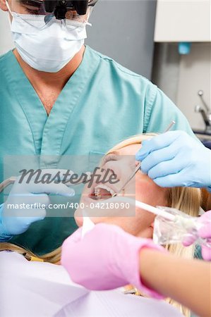 A dentist working on a tooth at a dental clinic
