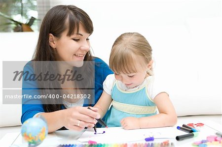 mother and daughter having fun in kindergarten