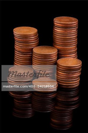 Money coin columns reflecting in the dark
