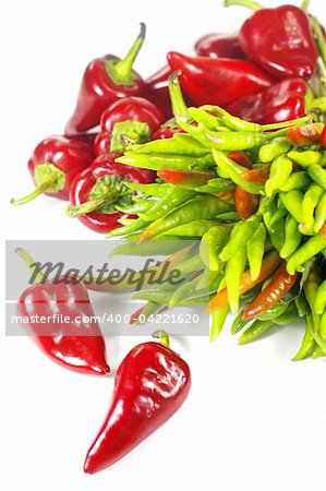 Red and green peppers on white background