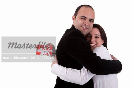 Man giving a gift to a woman, holding her