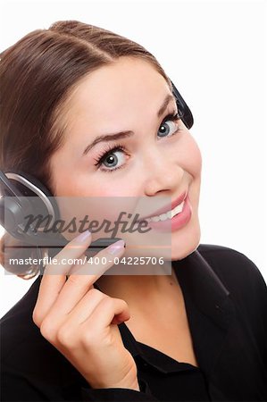 Pretty caucasian woman with headset smiling during a telephone conversation.