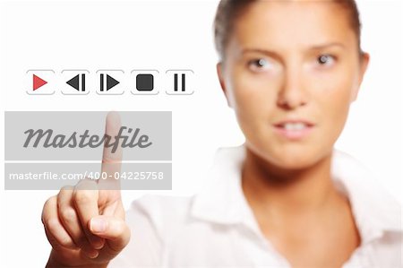 A picture of a young pretty businesswoman touching the button over white background