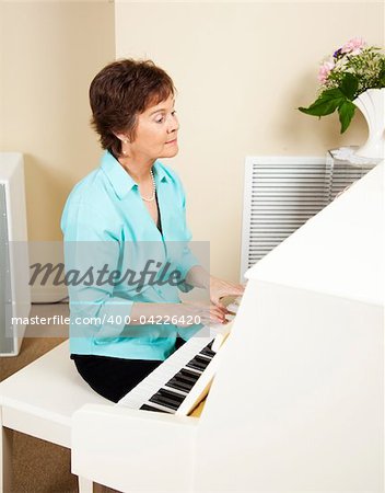 Pianist playing hymns on the church piano.