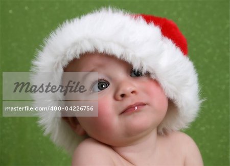 Dreamy Christmas image of a baby looking into the distance