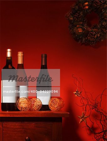 WIne Bottles in festive setting with decorations and wreath