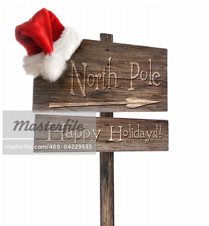 Weathered wooden sign with santa hat on white background