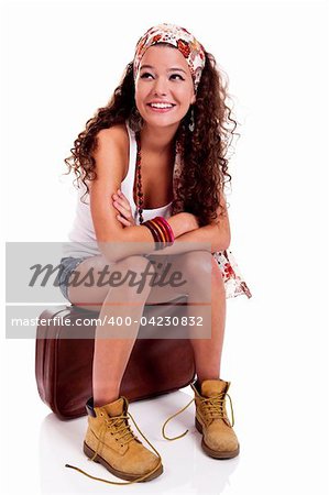 Beautiful and happy young woman with a old suitcase, isolated on white background