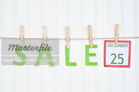 SALE on a Clothesline with a Christmas Calendar Page.  Holiday Concept.