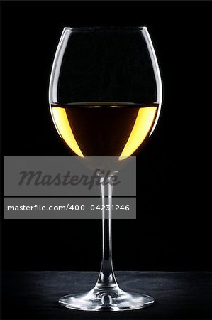 White wine glass silhouette over black background