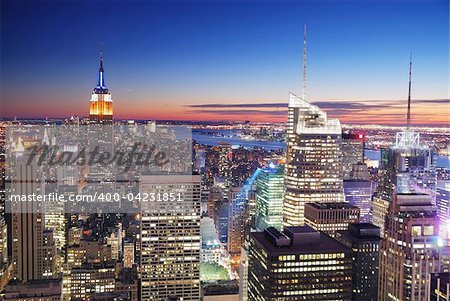 New York City Manhattan skyline aerial view with Empire State Building and Times Square at sunset.