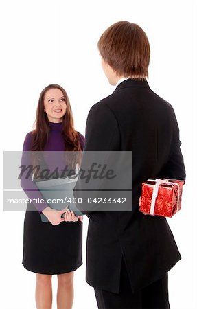 teen boy giving a gift to a girl. Isolated at white background