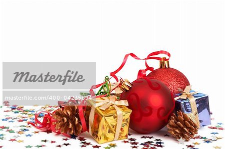 Red Christmas baubles and other decorations isolated on white background with copy space.